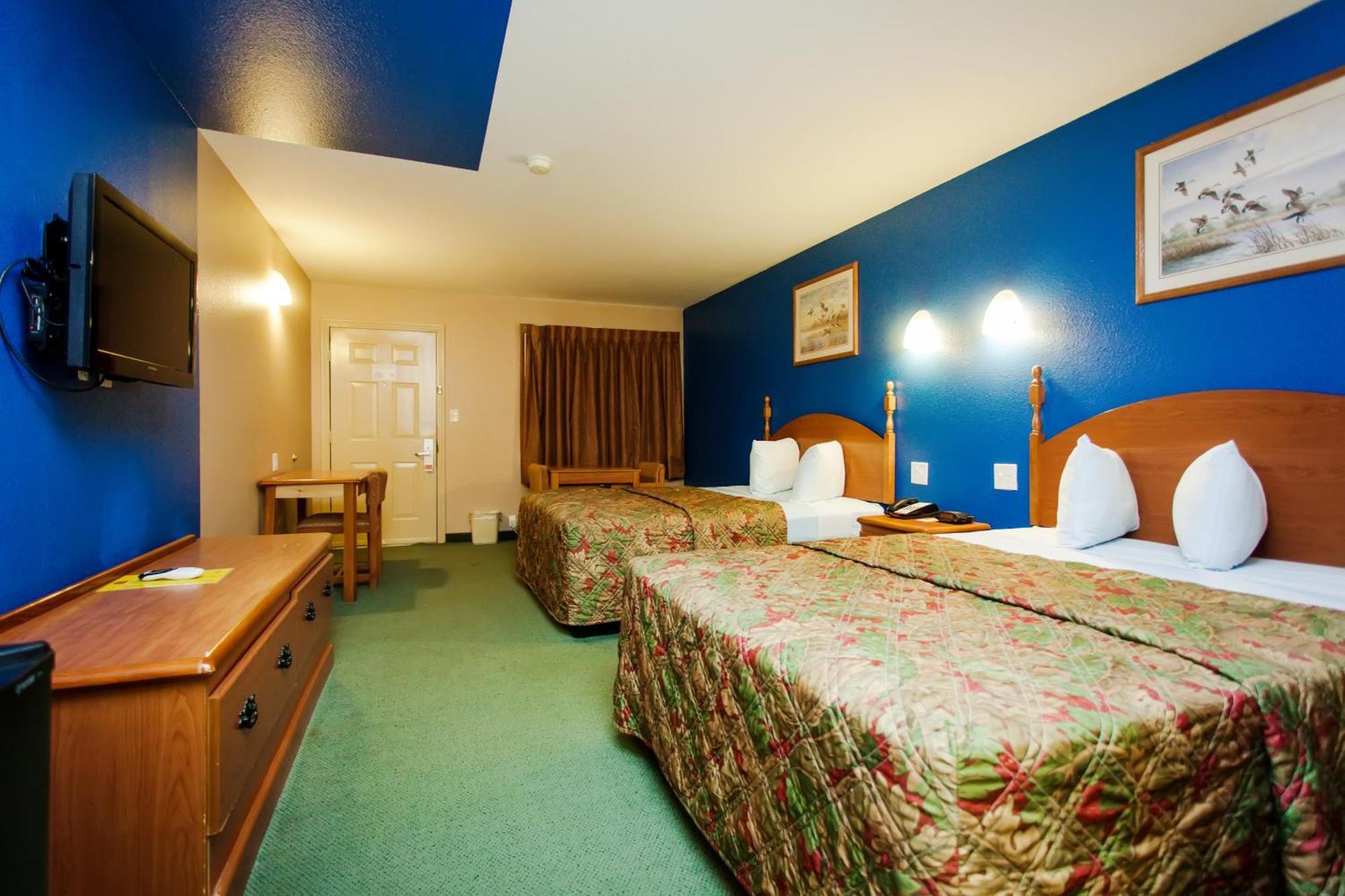 Scottish Inn & Suites Hankamer Quarto foto